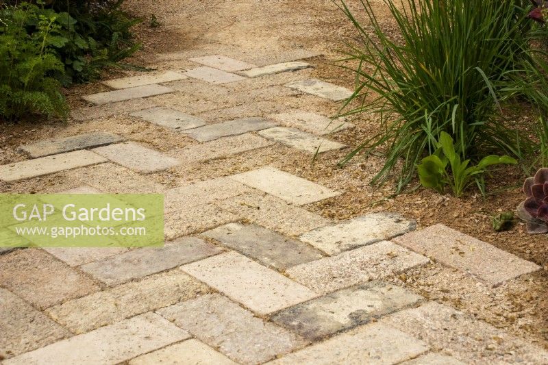 Brick path made from crushed terracotta pots on The Nurture Landscapes Garden - designer Sarah Price - RHS Chelsea Flower Show 2023