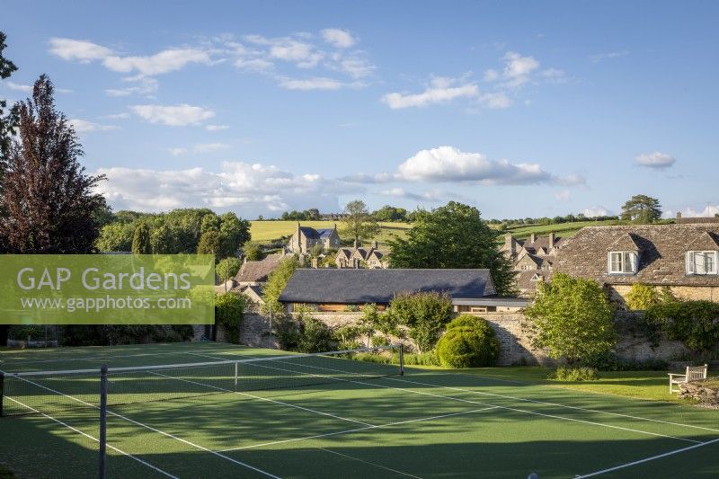 Tennis court in a cotswold garden